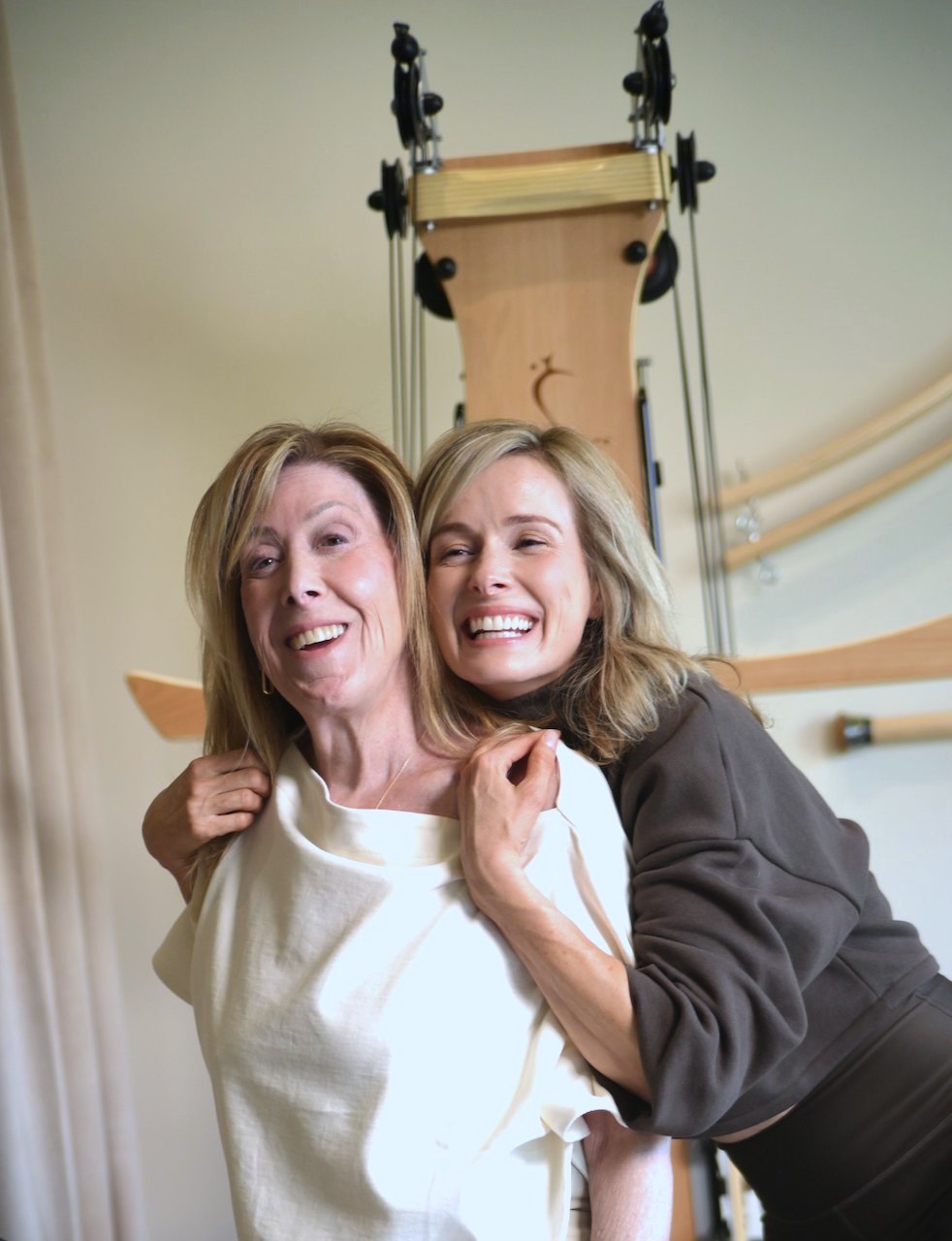 Devon Dionne and Gina Chai laughing together in the studio