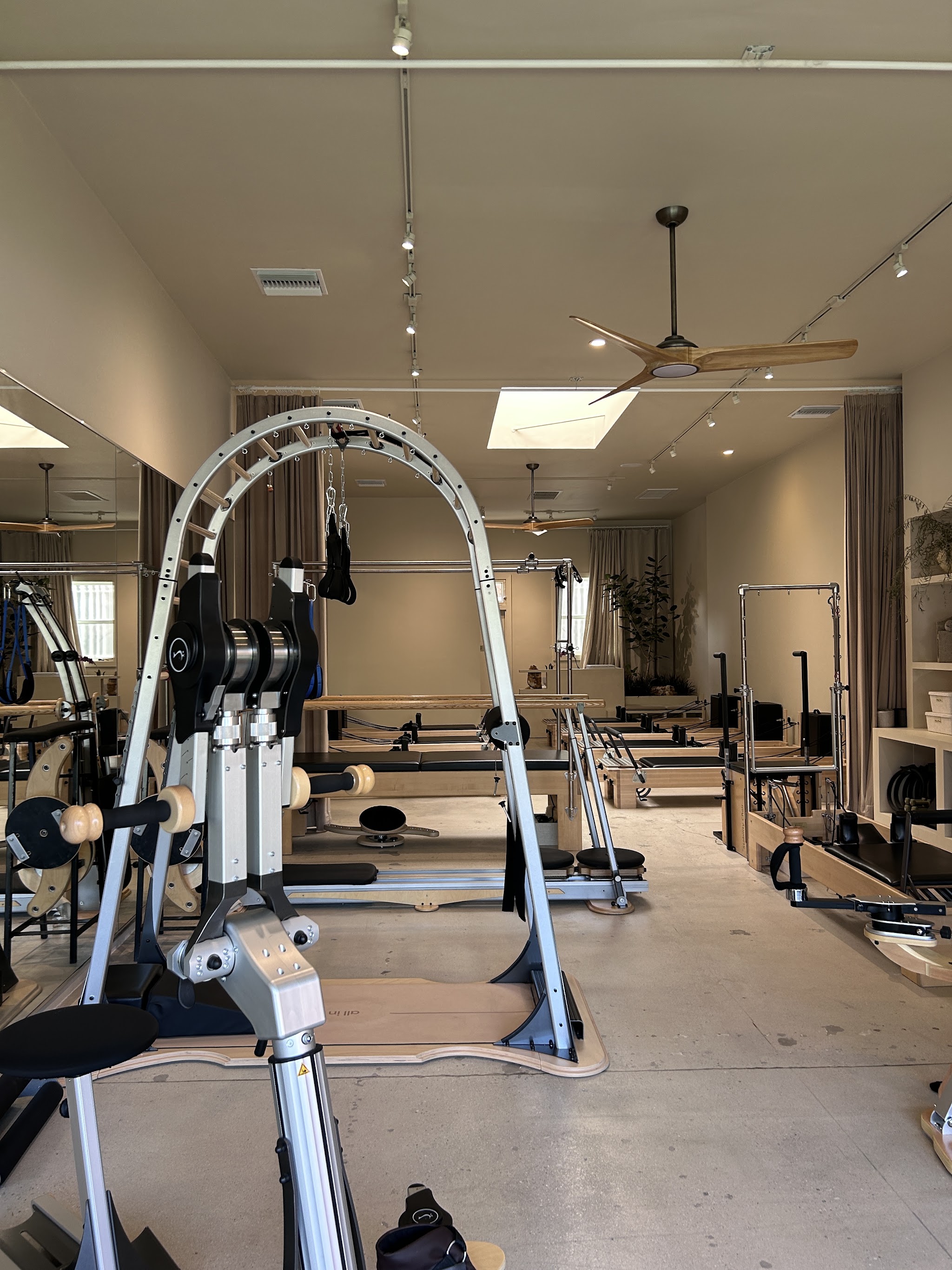 The studio floor with the ARCHWAY® and a row of reformers